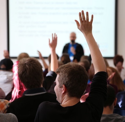 Students raising their hands